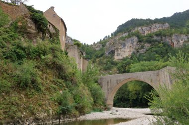 Sainte-Enimie, Gorges du Tarn in France - September 03 2024: people explore the lovely streets of the village clipart