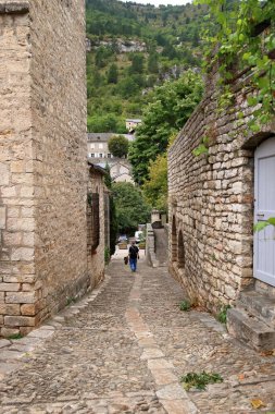 Sainte-Enimie, Gorges du Tarn in France - September 03 2024: people explore the lovely streets of the village clipart