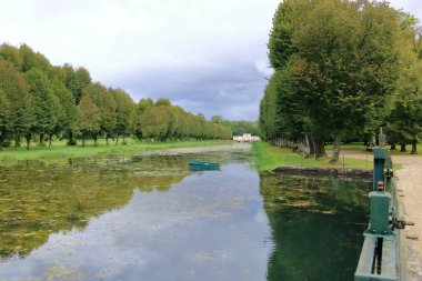 Tanlay, France in Europe - September 05 2024: people enjoy the majestic french castle and park clipart