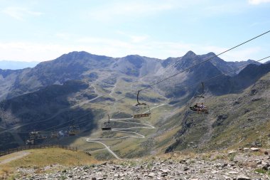 Ordino Arcalis, Mirador Solar de Tristaina in Andorra - August 30 2024: people use the chairlift to the mountain peak clipart