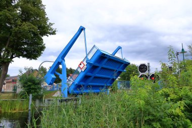 Wandlitz, Brandenburg in Germany - July 27 2024: a ship passes the Zerpenschleuse at the Finowkanal clipart