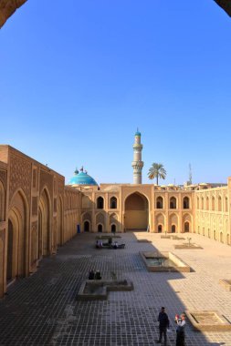 Baghdad, Bagdad in Iraq - November 15 2024: people visit the Al-Mustansiriya School Madrasah in Baghdad clipart