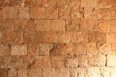 Tuğla duvar dokusu. Turuncu sarı kırmızı tuğla bina duvarı, Irak, Orta Doğu