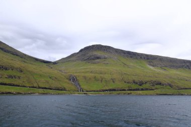 Waterfall at the Vagar island at Faroe Islands in Denmark