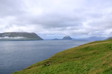 view to Hestur and Koltur Island from Kirkjubour at Streymoy Island, Faroe Islands in Denmark