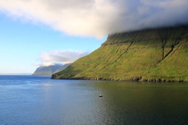 the sea passage between Eysturoy, Bordoy and Kalsoy at Faroe Islands seen from the sea, Denmark