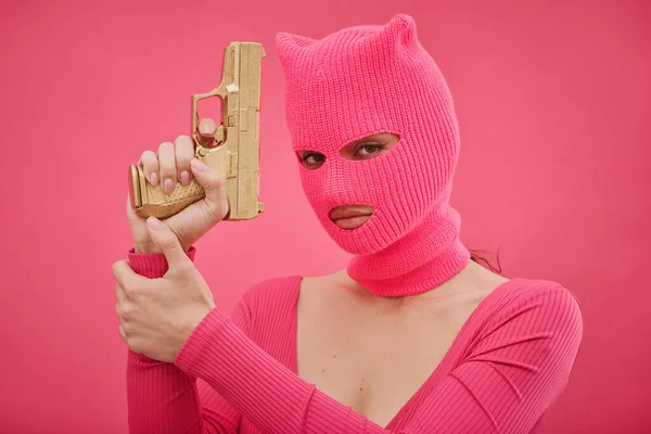 Portrait Gangster Girl Pink Holding Gun Protecting Herself Isolated Pink — Stock Photo, Image