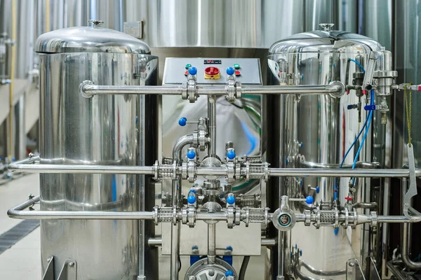 stock image Horizontal image of clean steel storage tanks for drinks with control panel standing in modern factory