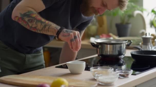 Bearded Male Chef Putting Peppercorns Mortar Crushing Them Pestle While — Stock Video