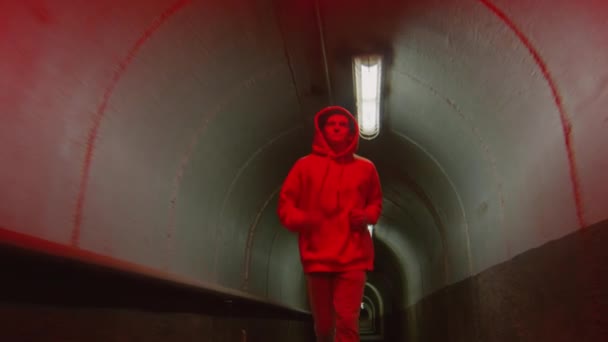 Dolly Shot Young Guy Streetwear Running Camera Dark Tunnel Flickering — Stock Video