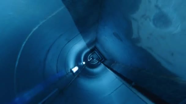 Cinematic Camera Roll Shot Dark Underpass Blue Neon Light People — Stock Video