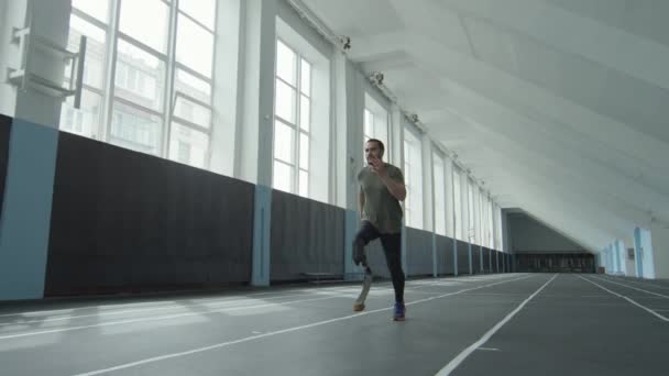 Slow Motion Shot Professional Sportsman Prosthetic Leg Running Track While — Stock Video