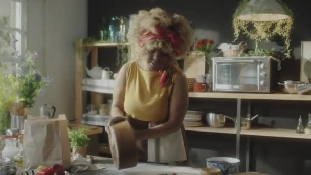 Medium Shot African American Woman Putting Dough Kitchen Table Speaking — Stock Video