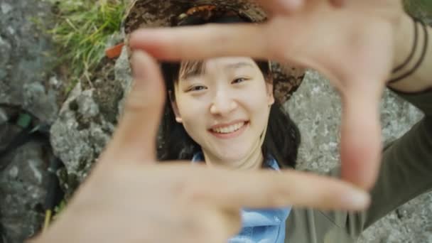 Top Shot Happy Asian Female Tourist Lying Rock Looking Camera — Stock Video