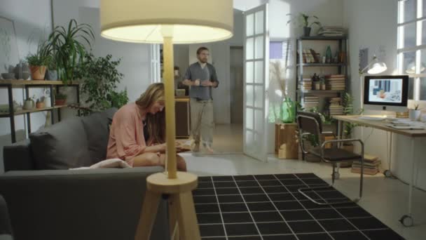 Full Shot Man Entering Living Room Sitting Desk Working Interior — Stock Video