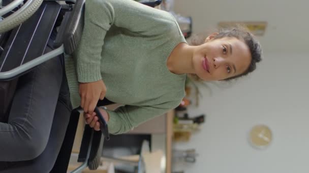 Vertical Shot Young Woman Sitting Wheelchair Holding Smartphone Smiling Camera — Stock Video