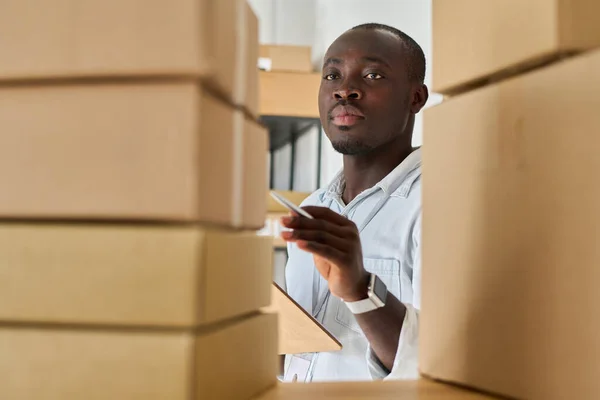 Young Serious African American Manager Warehouse Document Looking Stack Packed — Stock Photo, Image