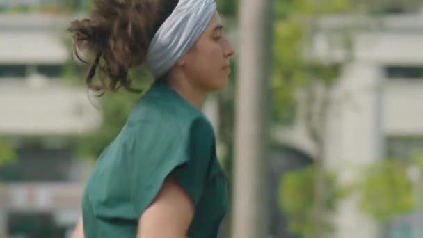 Slow Motion Shot Young Sportive Woman Jogging Sidewalk City While — Vídeo de Stock