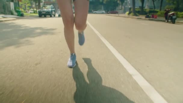 Tilt Slow Motion Shot Young Female Runner Jogging City Street — Stock Video