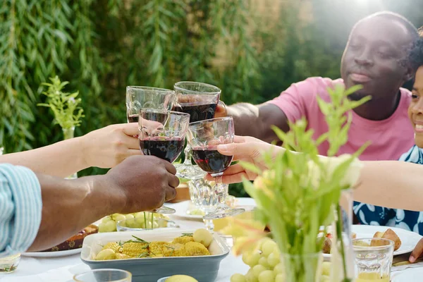 Hands Several Intercultural Family Members Drinks Clinking Glasses Table Served — Stock Photo, Image
