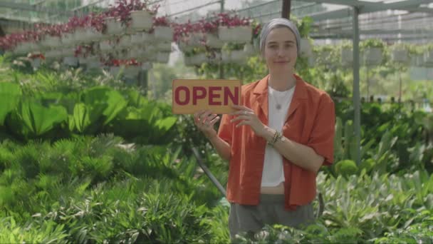Portrait Female Plant Nursery Worker Holding Open Sign Posing Camera — Stock Video