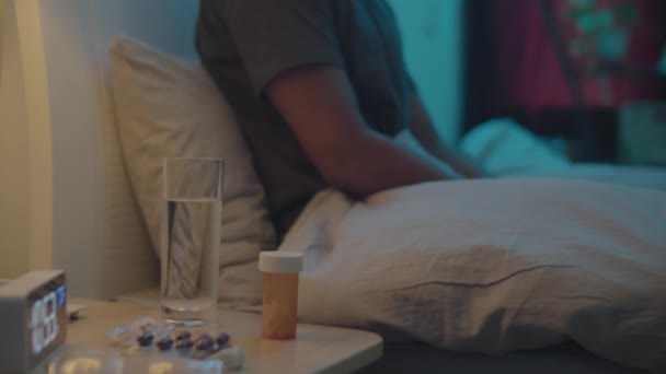 Tilt Shot Man Taking Sleeping Pills While Sitting Bed Home — Stock Video