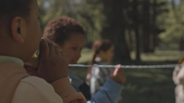 Little African American Girl Speaking Listening Tin Can Walkie Talkies — Stock Video