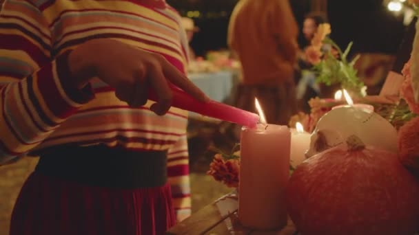 Tilt Hispanic Little Girl Half Painted Face Lighting Candle Altar — Stock Video