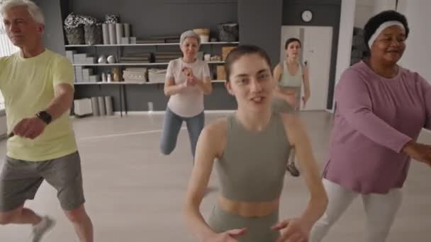 Young Female Fitness Trainer Group Senior People Sportswear Doing Butt — Stok Video
