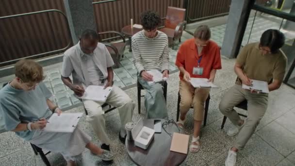 High Angle Shot Group Diverse People Reading Questions Writing Papers — Stock Video