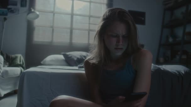 Handheld Shot Sad Teen Girl Sitting Floor Dark Bedroom Reading — Stock Video