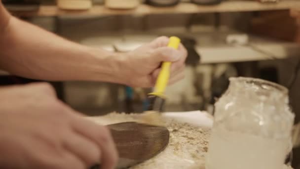 Close Shot Hands Shoemaker Applying Glue Brush Shoe Sole Workbench — Stock Video