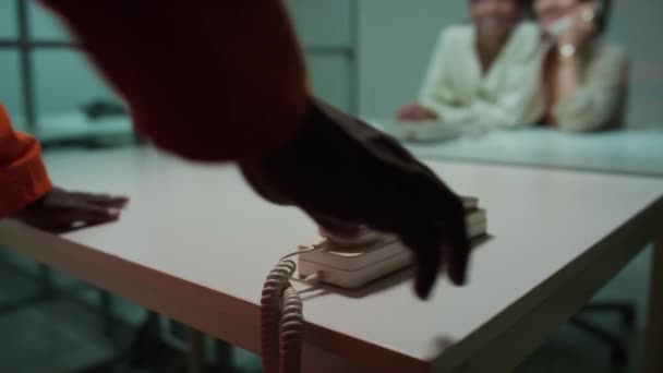 Foreground Focus Shot Black Prisoner Walking Visiting Room Sitting Table — Stock Video