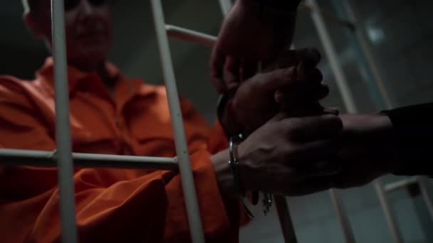Close View Hands Unrecognizable Prison Guard Taking Handcuffs Female Inmate — Stock Video