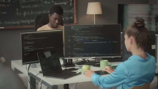 Young Caucasian Female Programmer Her African American Colleague Coding Computers — Stock Video