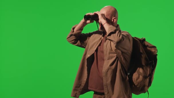 Hiker Backpack Khaki Outfit Looking Binoculars While Standing Green Chroma — Stock Video