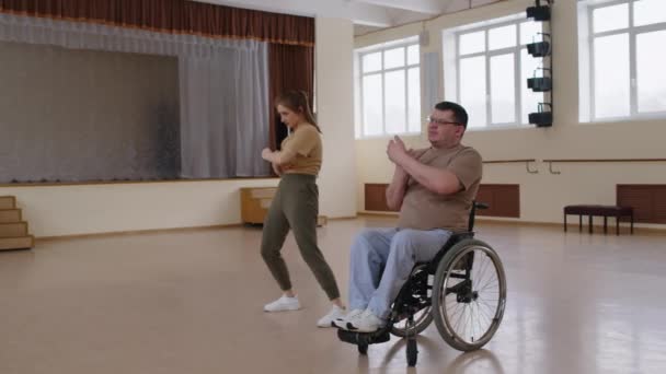 Young Female Teacher Man Wheelchair Dancing Together Studio Hugging Each — Stock Video