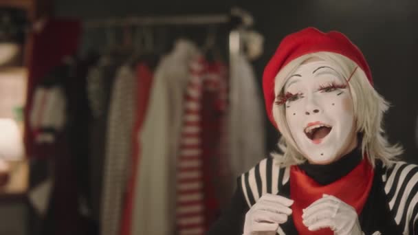 Female Mime Artist Sitting Dressing Room Looking Mirror Singing Song — Stock Video