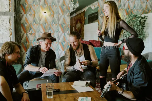 stock image Group of gen X and gen Y musicians spending time in abandoned house working together on rock music album