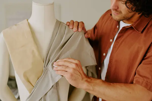 stock image Medium close up of male famous tailor creating female clothing in atelier