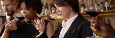 Website banner of biracial professional sommeliers estimating perfect scent of dry wine clipart