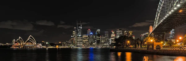 Sydney Opera House at night from Milsons Point and with skyline in the background. Reupload after color correction