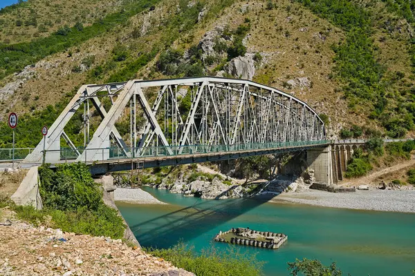 stock image Dragoti Bridge over the Vjosa river seen from the northern side of the river.