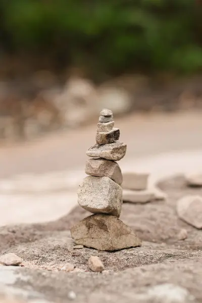 stock image Stones stacked high with blurred background. Rocks stacked high in layers. 