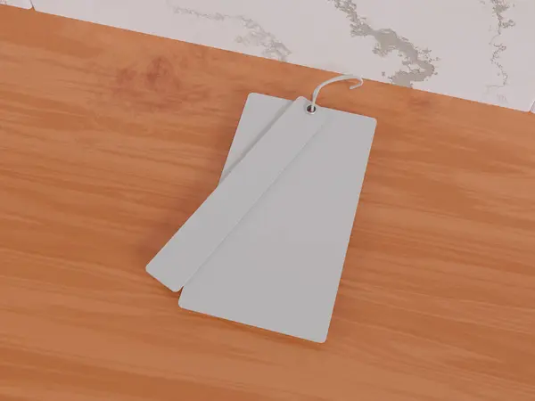 3Dレンダリング テーブル上の空白のハングタグ トップビュー モックアップデザイン — ストック写真
