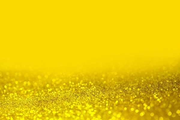 Yellow blurred bokeh background. Abstract background Christmas lights festive with defocused yellow bokeh.