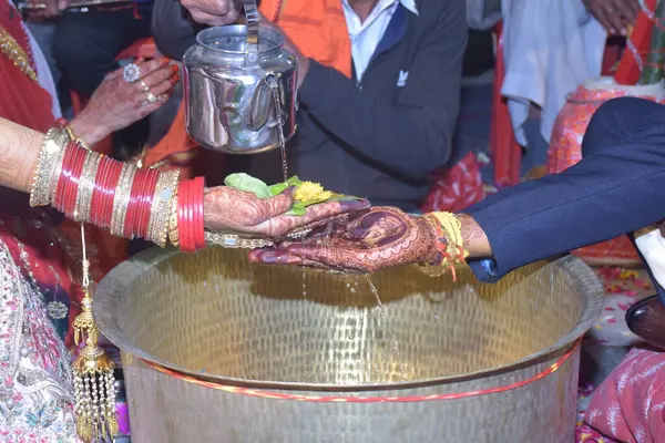 stock image Wedding Couple Nice Hands, hindu groom and bride's hands during marriage ceremony, water eclipse ceremony