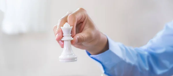 hand moves chess with strategy and tactic to win enemy, play battle on board game, business opportunity competition strategic challenge concept.