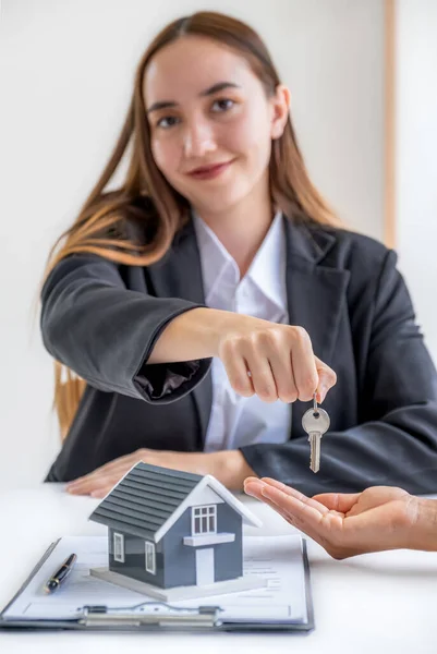 Caucasian real estate agents sale broker and buyers sign a business contract at home office and discuss saving money for renting, buying mortgage loan, or financial house insurance.