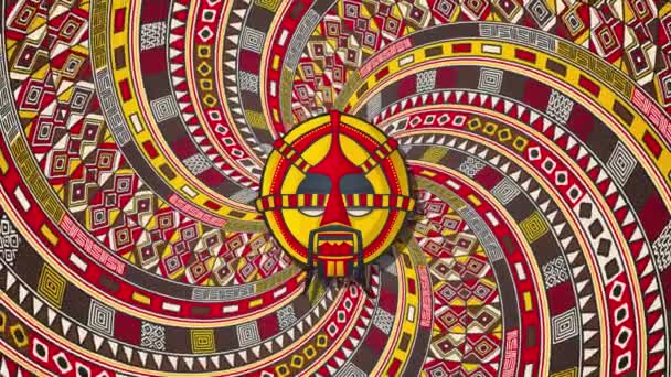 回転する螺旋状の背景 ループアニメーション上の部族のマスク — ストック動画